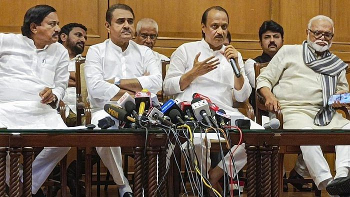 Maharashtra Deputy Chief Minister Ajit Pawar with Chhagan Bhujbal, Praful Patel, Sunil Tatkare and others during a press conference. Credit: PTI Photo  