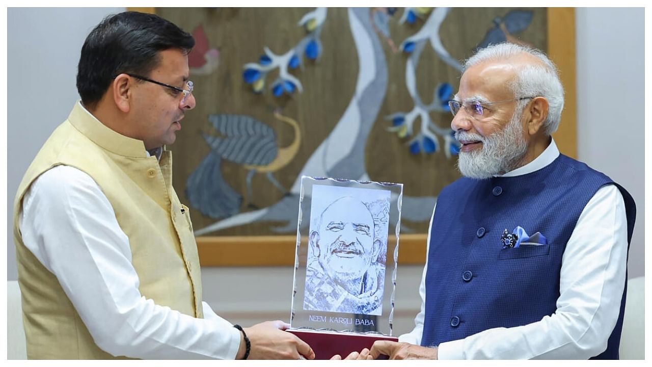 Prime Minister Narendra Modi being presented a memento by Uttarakhand Chief Minister Pushkar Singh Dhami during a meeting, in New Delhi, Tuesday, July 4, 2023. Credit: Twitter/@pushkardhami