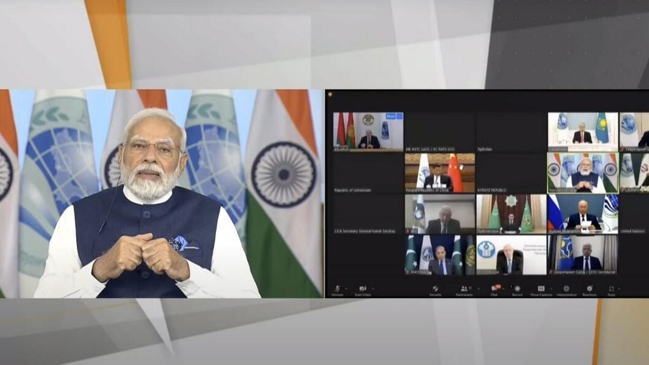 Prime Minister Narendra Modi addresses the 23rd Summit of the SCO Council of Heads of State via video conferencing. Credit: PTI Photo