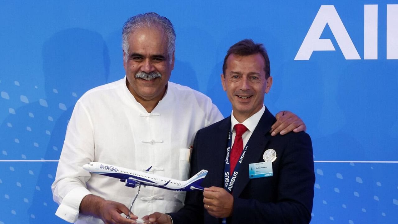 Rahul Bhatia, Managing Director of IndiGo and Guillaume Faury, CEO of Airbus, attend a news conference, after a purchase agreement between IndiGo and Airbus for 500 A320 Family aircraft, at the 54th International Paris Airshow. Credit: Special Arrangement