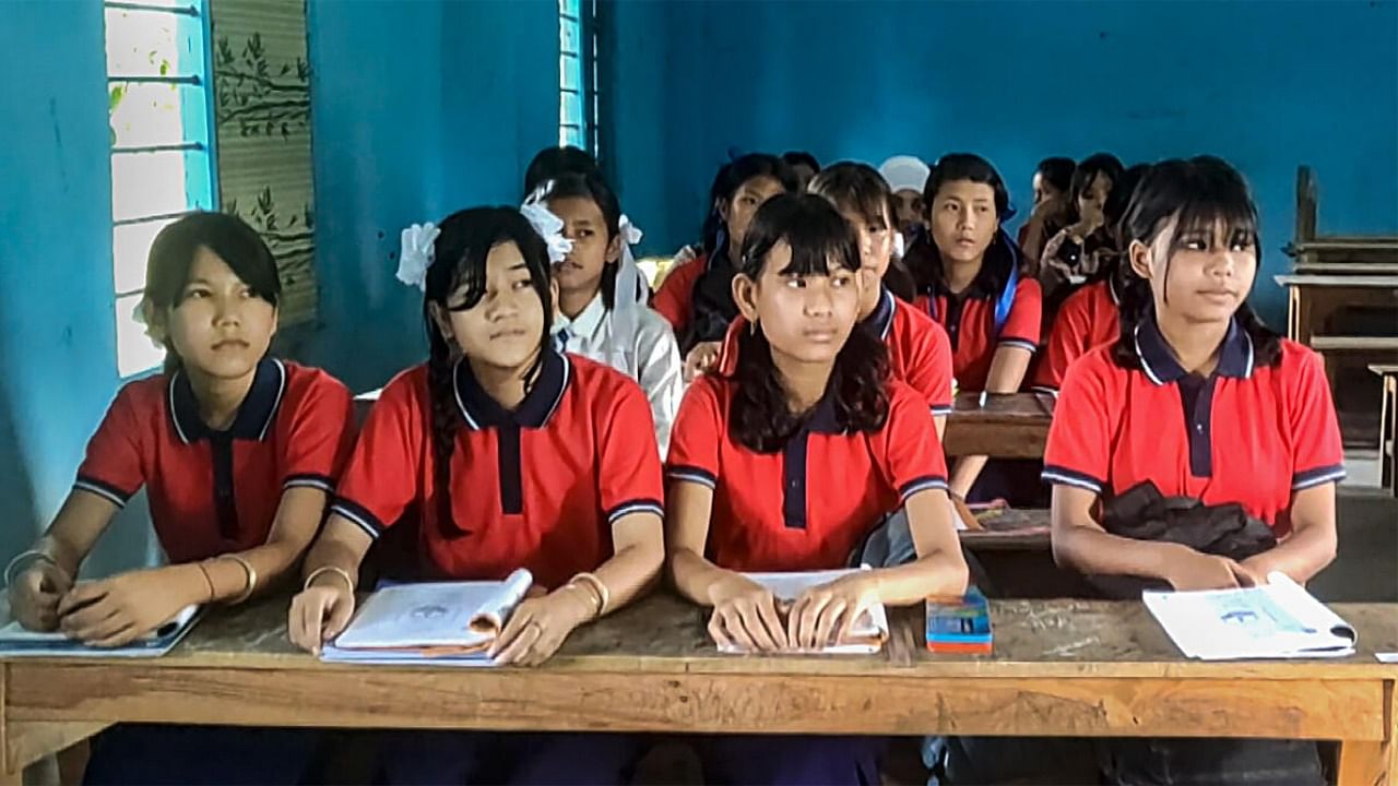  Imphal: Students attend a class at a school that reopened after remaining shut for months because of ethnic clashes in Manipur. Credit: PTI Photo