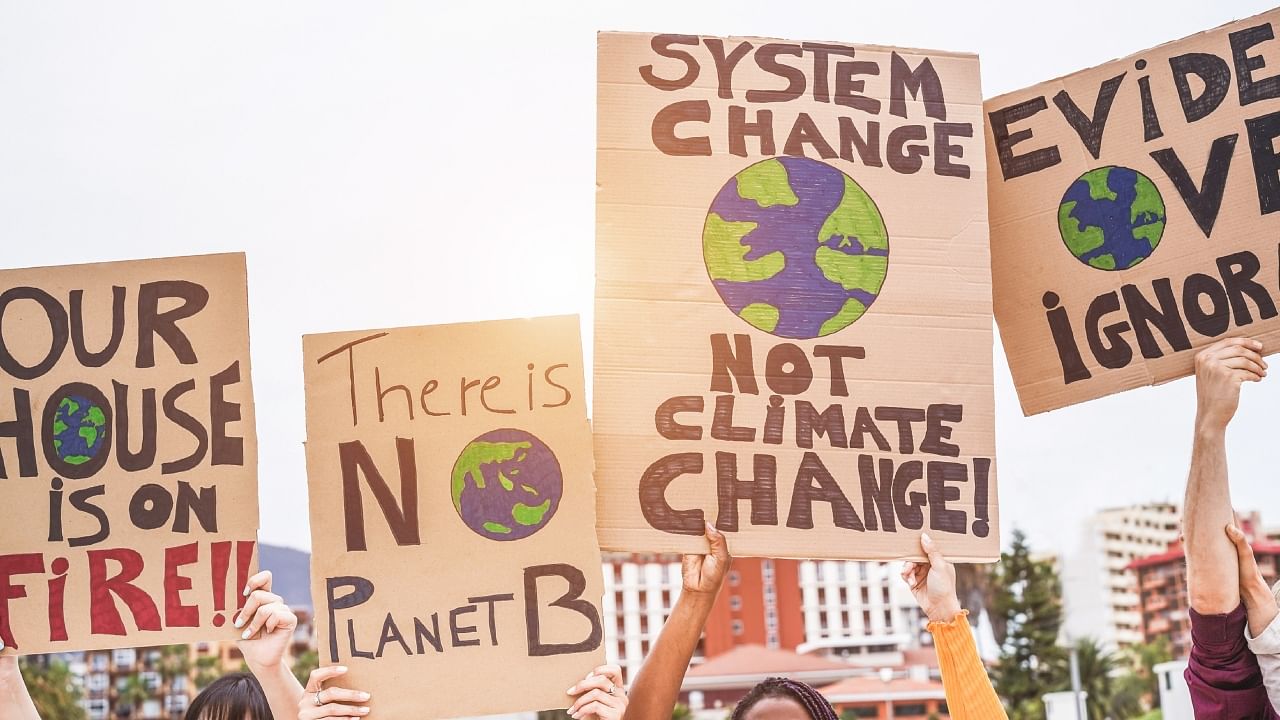 <div class="paragraphs"><p>Group of demonstrators and people from different culture and race protest over climate change. </p></div>