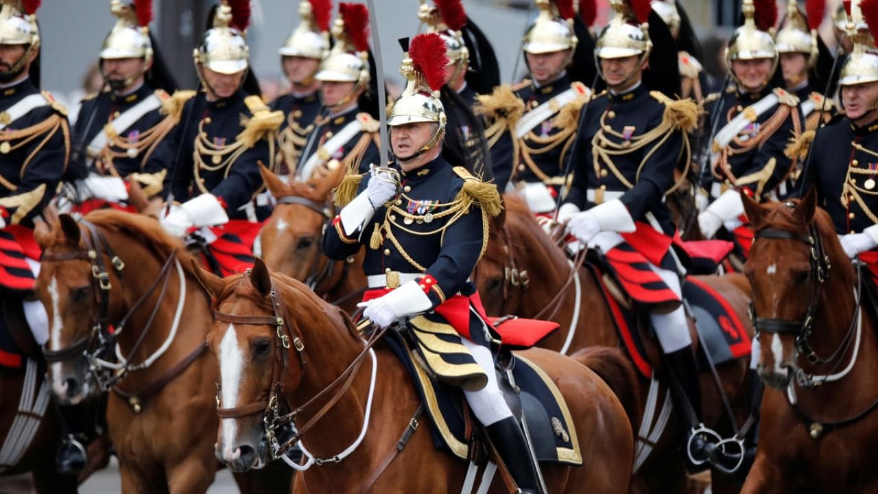 The Cavalry Regiment of the French Republican Guard parades during the traditional Bastille Day military parade on the Champs-Elysees Avenue in Paris, France, July 14, 2019. Credit: Reuters Photo