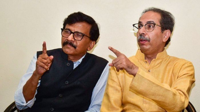 Shiv Sena (UBT) leaders Sanjay Raut (L) and Uddhav Thackeray (R). Credit: PTI File Photo 