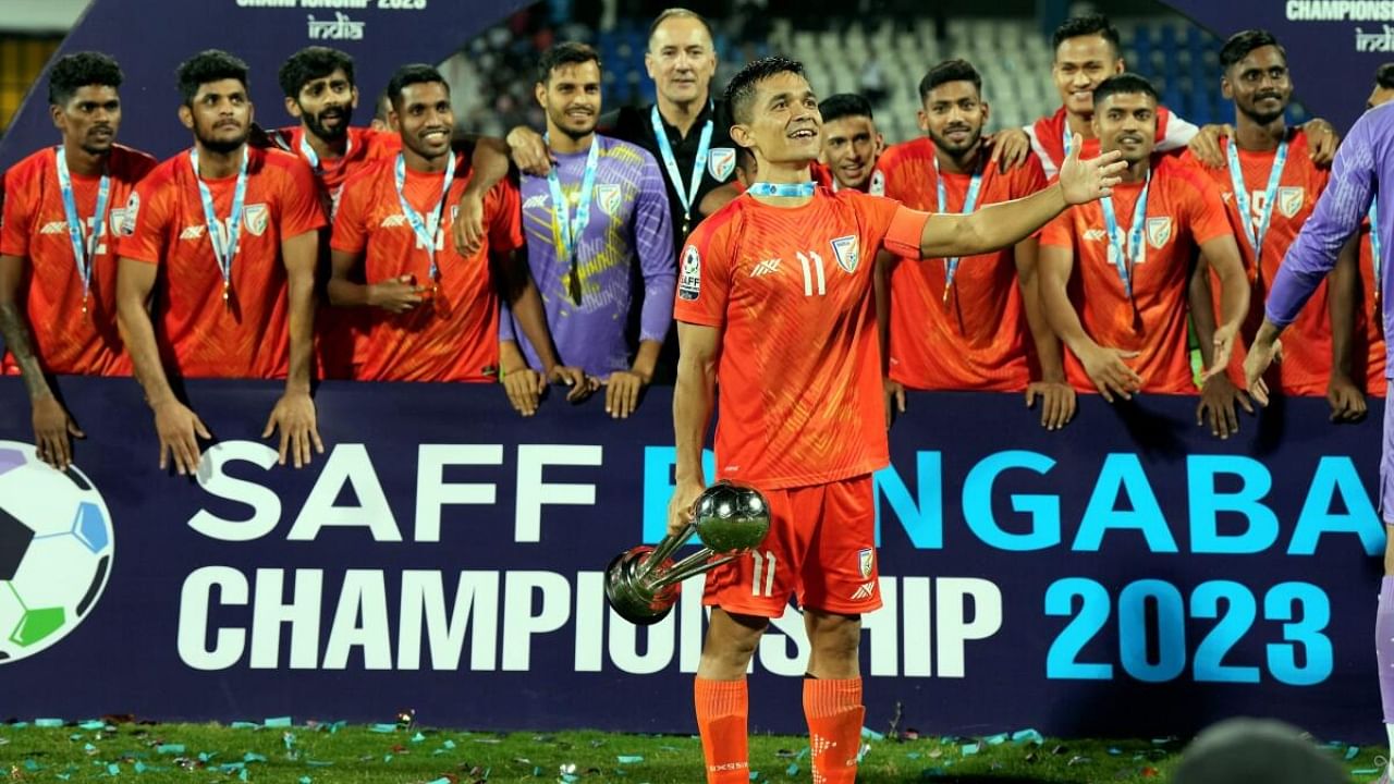 Sunil Chhetri lifts the SAFF Championship 2023 trophy with teammates during celebration after defeating Kuwait in the final match at Kanteerava Stadium. Credit: PTI Photo