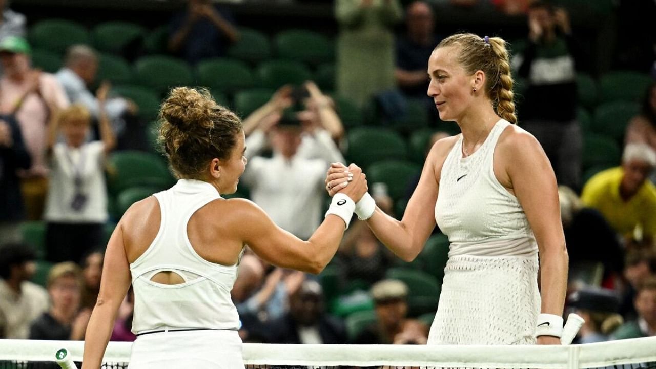 Tennis - Wimbledon - All England Lawn Tennis and Croquet Club, London, Britain - July 5, 2023 Czech Republic's Petra Kvitova shakes hands with Italy's Jasmine Paolini after winning her first round match. Credit: Reuters Photo