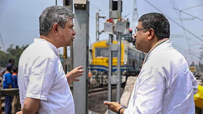 Railways Minister Ashwini Vaishnaw with Union Minister Dharmendra Pradhan. Credit: PTI File Photo 