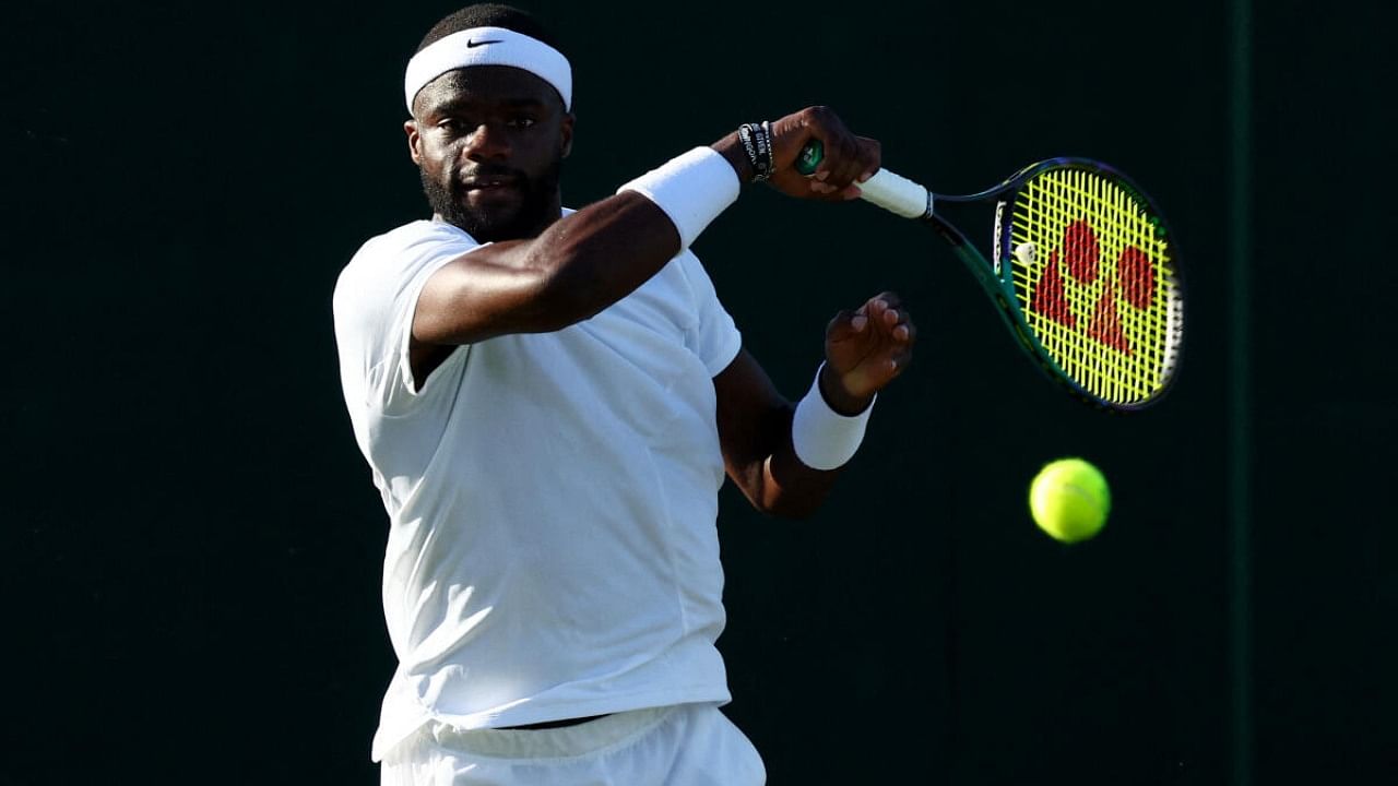 Tennis - Wimbledon - All England Lawn Tennis and Croquet Club, London, Britain - July 6, 2023 Frances Tiafoe of the U.S. in action during his second round match against Switzerland's Dominic Stricker. Credit: Reuters Photo
