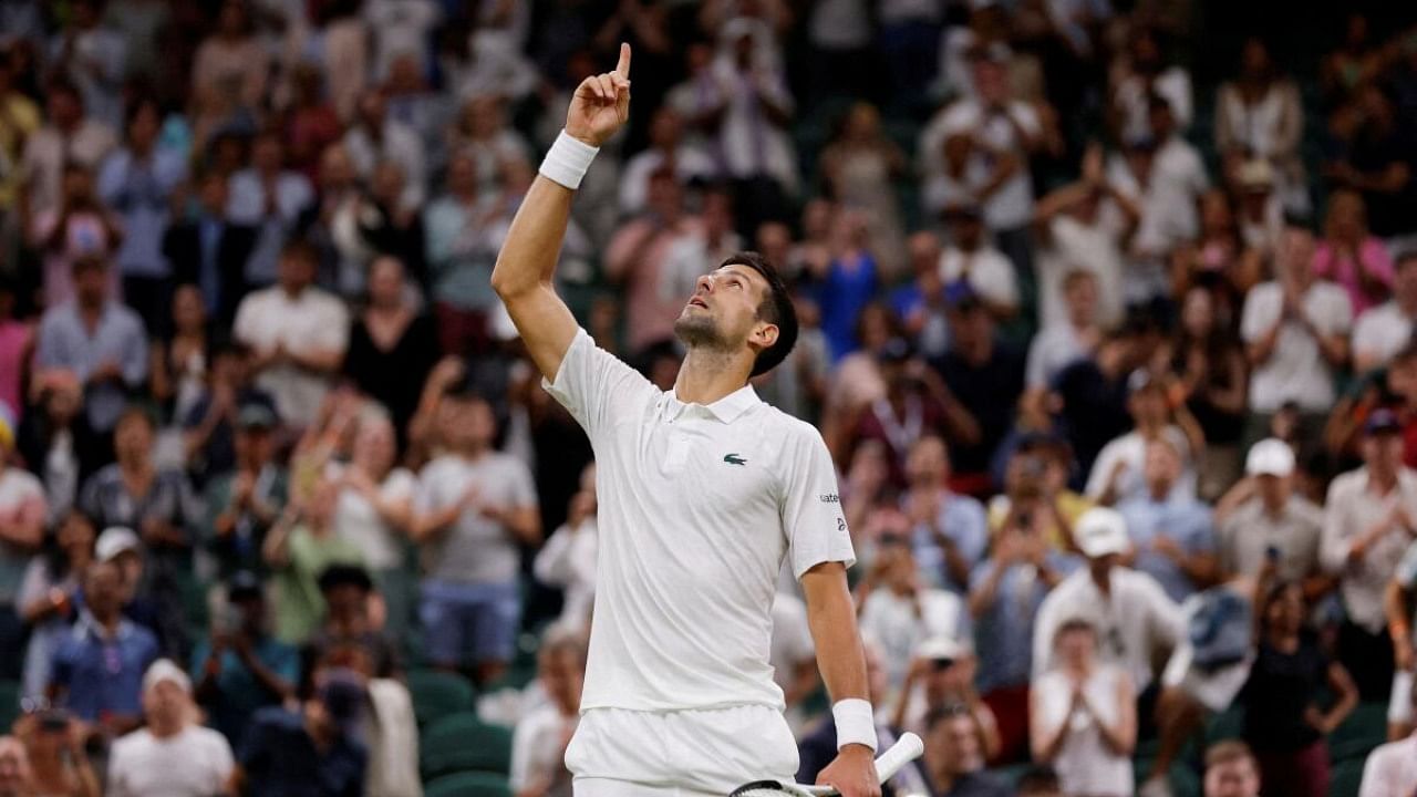 Serbia's Novak Djokovic celebrates winning his third round match against Switzerland's Stan Wawrinka. Credit: Reuters Photo