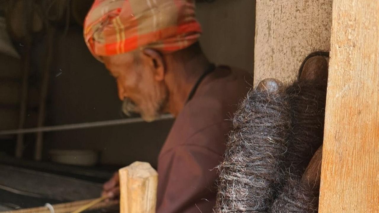 A member of the pastoral Kuruba community, which inhabits Northern Karnataka, weaves these woollen blankets. Credit: Special Arrangement