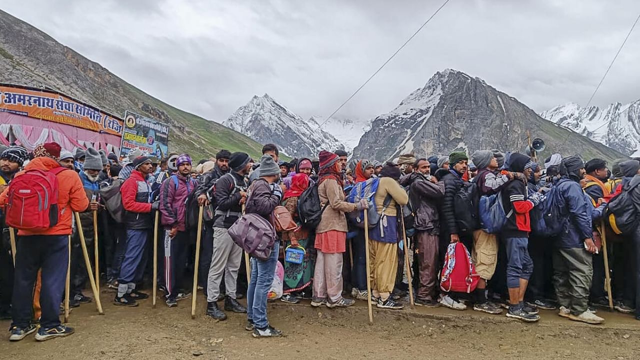 Pilgrims at Panchtarni base camp after the Amarnath Yatra was temporarily suspended for third consecutive day due to bad weather. Credit: PTI Photo