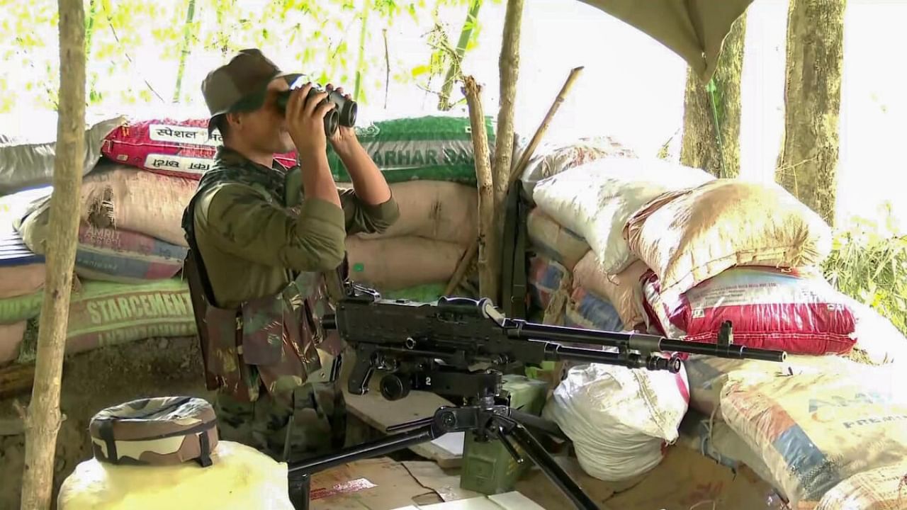 Personnel of Assam Rifles keep a watch amid ongoing ethnic clashes in Manipur. Credit: PTI Photo