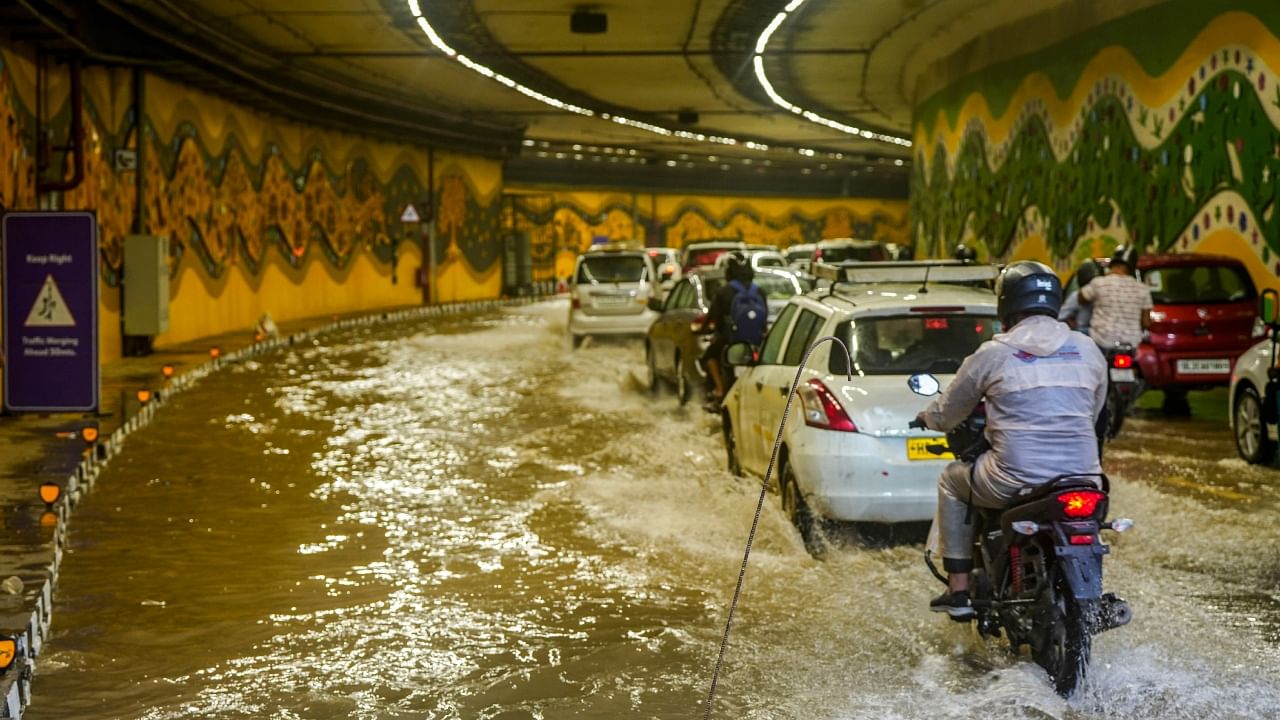 Vehicles pass through a waterlogged tunnel amid heavy monsoon rains, near Pragati Maidan in New Delhi, Saturday, July 8, 2023. Credit; PTI Photo