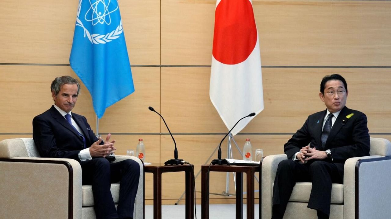 Rafael Mariano Grossi, Director General of the International Atomic Energy Agency, left, speaks with Japanese Prime Minister Fumio Kishida, right, before presenting IAEA's comprehensive report on Fukushima Treated Water Release to Kishida. Credit: Reuters Photo