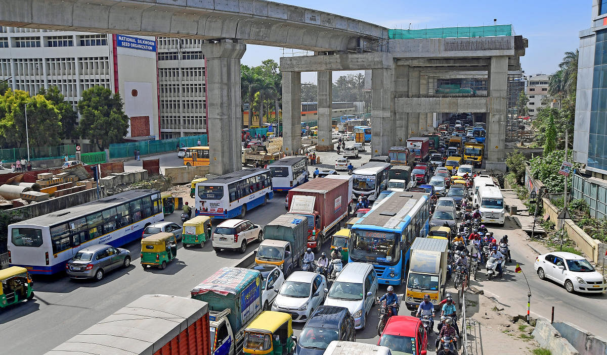 To combat this influx, they have opened up some U-turns below flyovers where preliminary metro work has completed. Credit: DH Photo