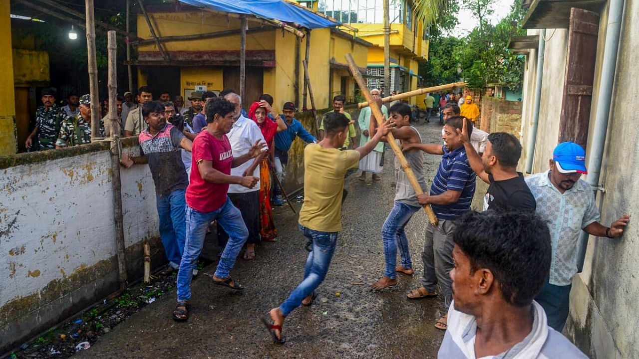 Workers of rival political groups in a clash during panchayat elections in West Bengal. Credit: PTI Photo