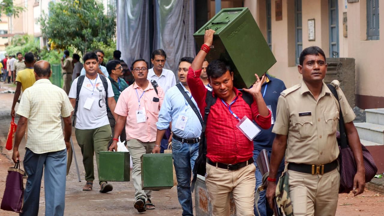 Polling officials carrying EVMs and other election material on the way to their respective polling booths ahead of the West Bengal panchayat elections, at Balurghat in South Dinajpur district, Friday, July 7, 2023. Credit: PTI Photo