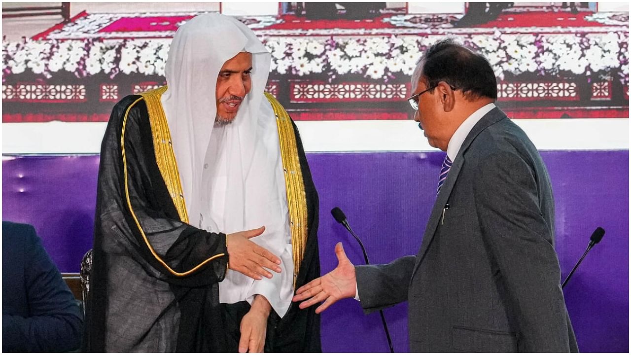 NSA Ajit Doval and Saudi Arabia leader and Secretary General of the Muslim World League Mohammad bin Abdulkarim al-Issa exchange greetings during an event at the India Islamic Cultural Centre, in New Delhi, Tuesday, July 11, 2023. Credit: PTI Photo
