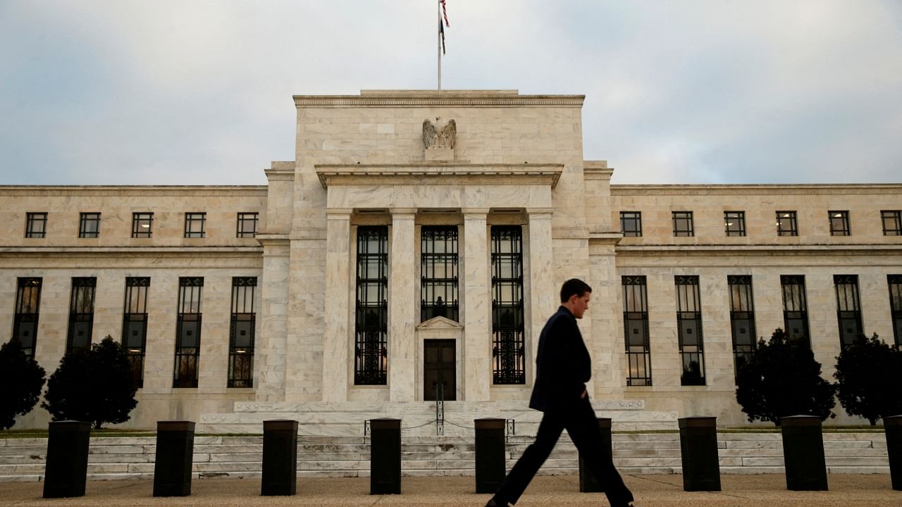 A man walks past the Federal Reserve in Washington. Credit: Reuters File Photo