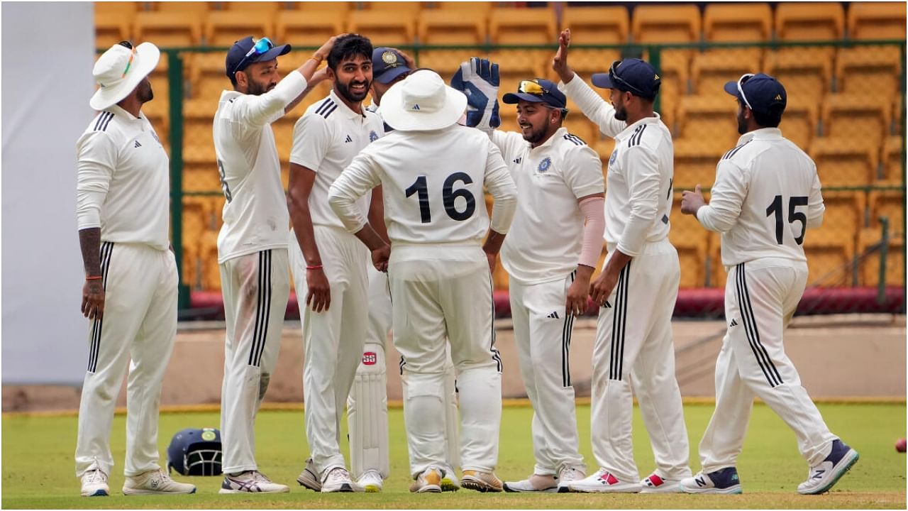 Bengaluru: West Zone bowler Chintan Gaja celebrates with teammates after the wicket of South Zone batter Ricky Bhui during the first day of the Duleep Trophy final cricket match between South Zone and West Zone, at M. Chinnaswamy Stadium in Bengaluru, Wednesday, July 12, 2023. Credit: PTI Photo
