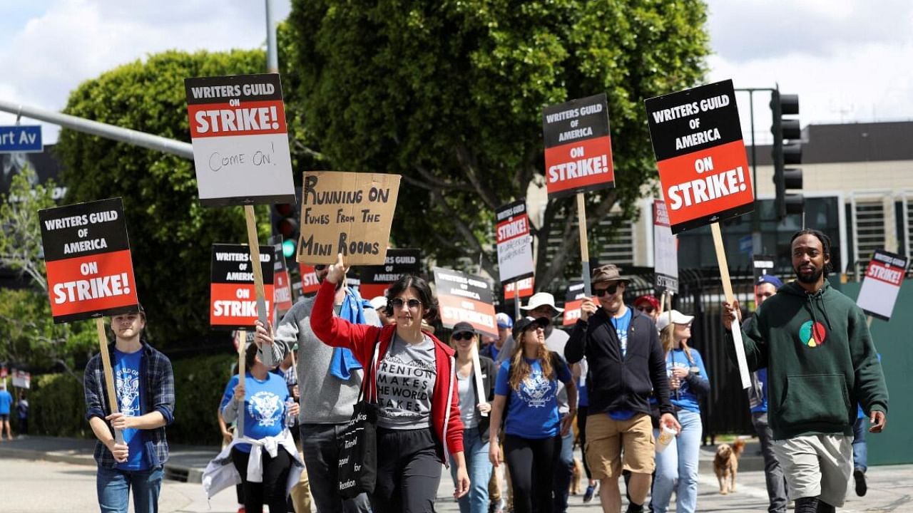 Workers and supporters of the Writers Guild of America protest outside Universal Studios Hollywood after union negotiators called a strike for film and television writers, in the Universal City area of Los Angeles, California, US, May 3, 2023. Credit: Reuters Photo
