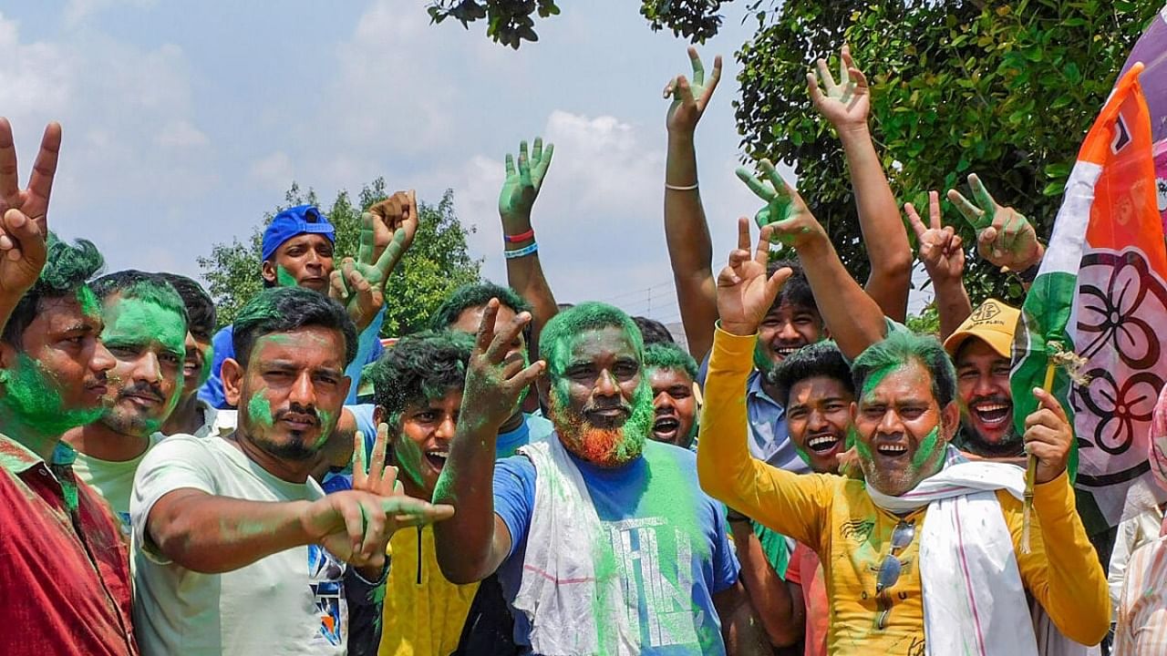 TMC workers and supporters celebrate the party's lead during the counting of votes of the West Bengal panchayat polls, in Bankura district, Tuesday, July 11, 2023. Credit: PTI Photo