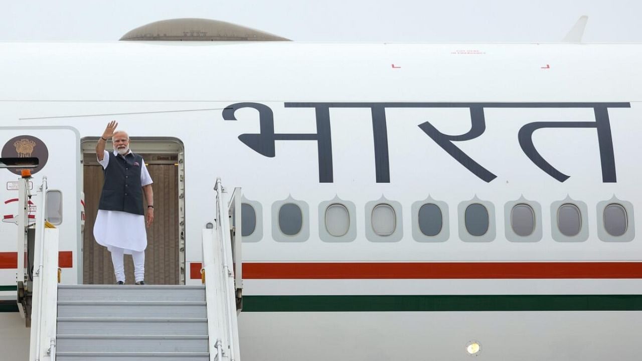 PM Modi boards an aircraft for his France visit. Credit: PTI Photo