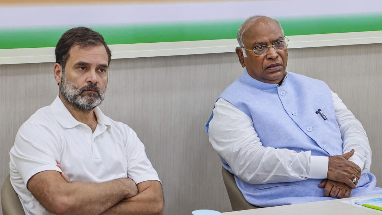 Congress President Mallikarjun Kharge with party leader Rahul Gandhi. Credit: PTI Photo