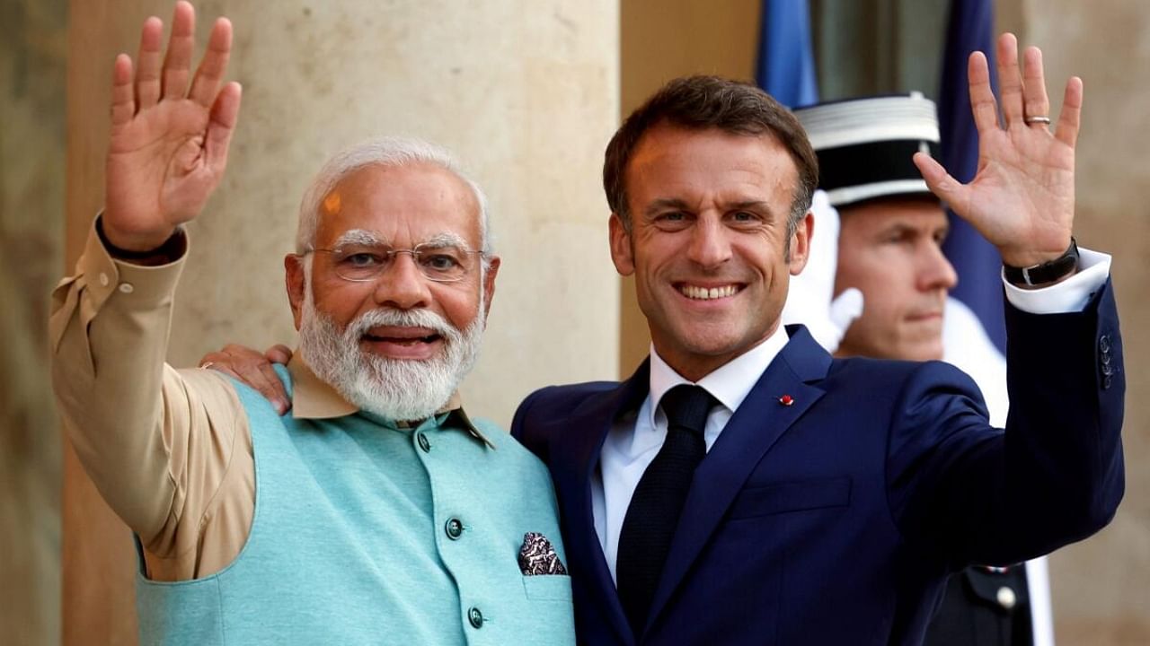 Paris: Prime Minister Narendra Modi being welcomed by the President of the France Emmanuel Macron at Elysee Palace, in Paris, Thursday, July 13, 2023. Credit: PTI Photo