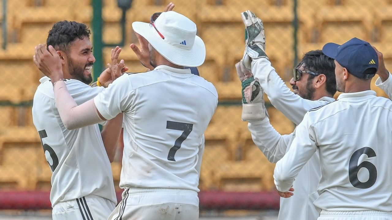 Vidwath Kaverappa (left) of South Zone celebrates with team-mates after dismissing a West Zone player on second day of the Duleep Trophy final at the M Chinnaswamy Stadium in Bengaluru on Thursday. Credit: DH Photo/S K Dinesh