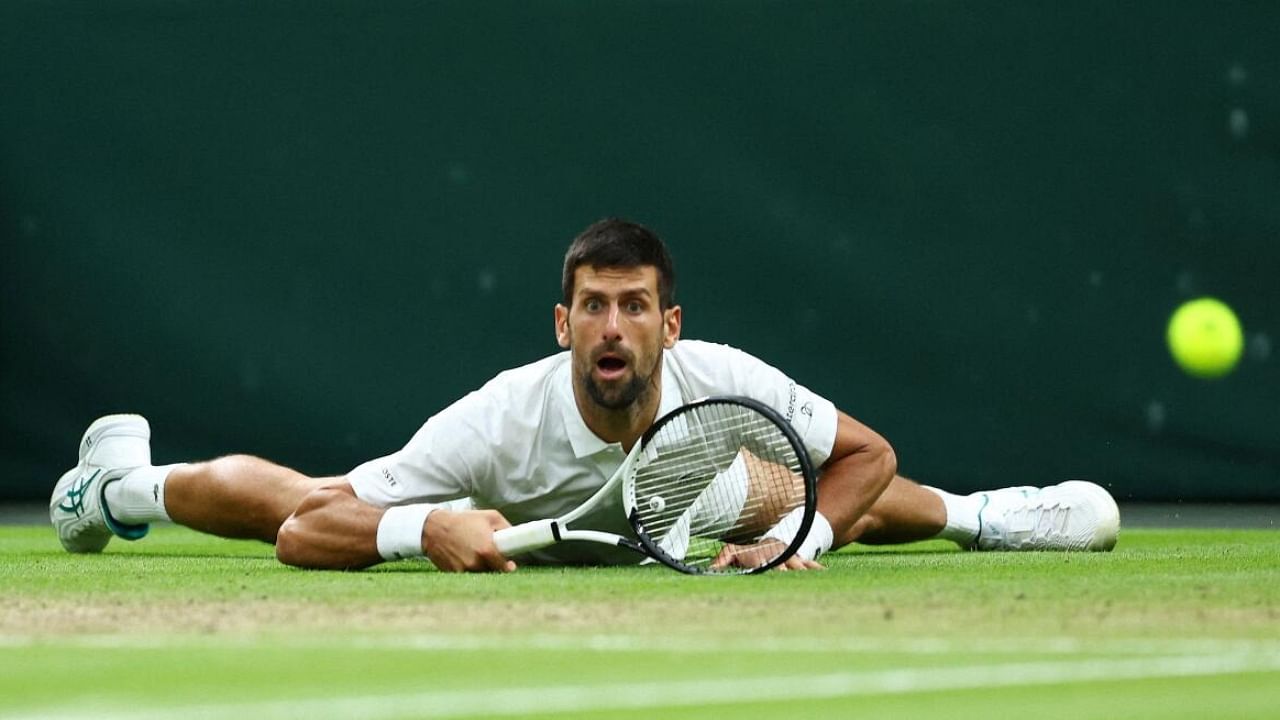 Serbia's Novak Djokovic reacts during his semi final match against Italy's Jannik Sinner. Credit: Reuters Photo