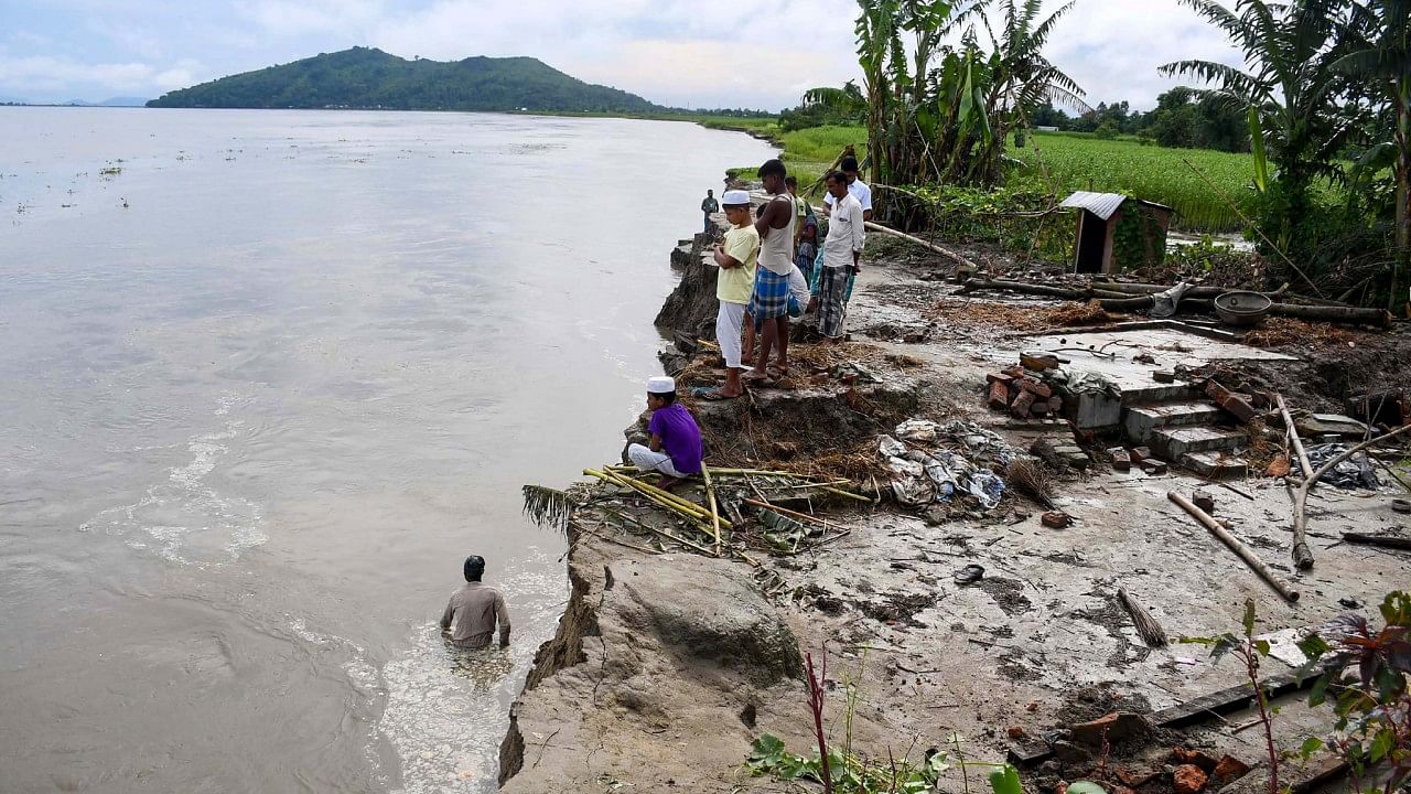 Villagers at the erosion site of the River Brahmaputra. Credit: PTI File Photo