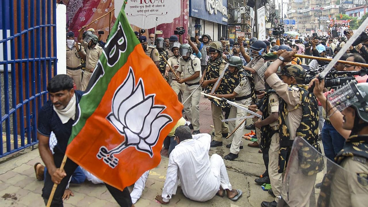 Security personnel baton charge BJP supporters during their Vidhan Sabha march in support of demands of teachers' job aspirants. Credit: PTI Photo
