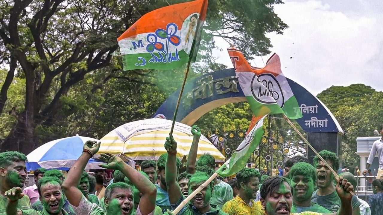 TMC workers and supporters celebrate the party's lead during the counting of votes of the West Bengal panchayat polls, in Nadia. Credit: PTI File Photo