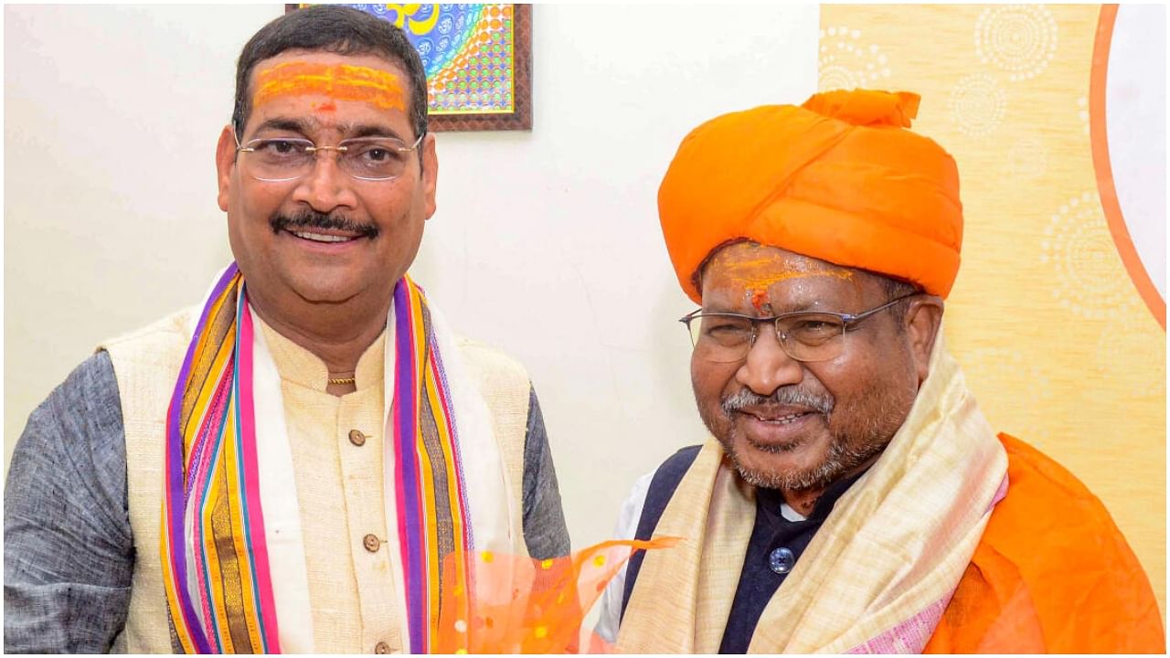 Rajya Sabha Member Deepak Prakash congratulates the newly-appointed Jharkhand BJP President Babulal Marandi after taking official charge at the party headquarters, in Ranchi, Saturday, July 15, 2023. Credit: PTI Photo