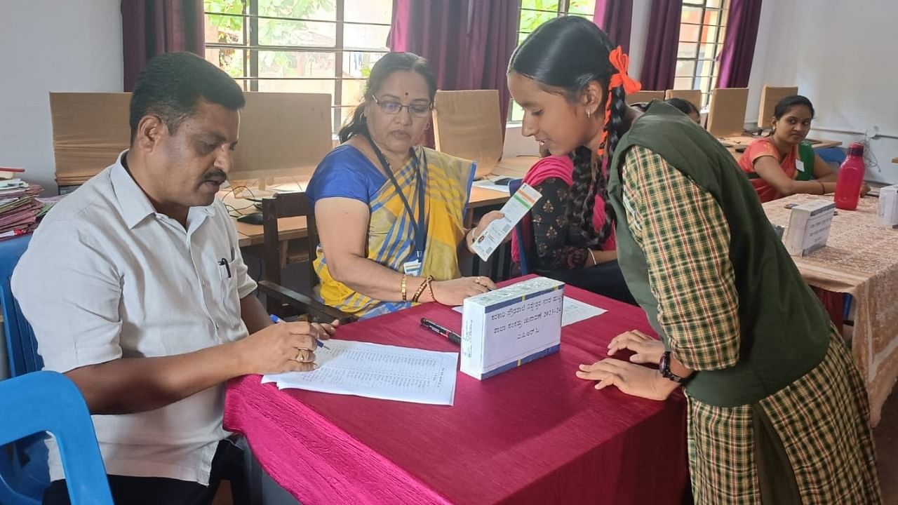 Name of a girl student being checked in the 'voters' list' during the school parliament election at the Government High School at Vishweshwar Nagar in Hubballi. Credit: Special Arrangement