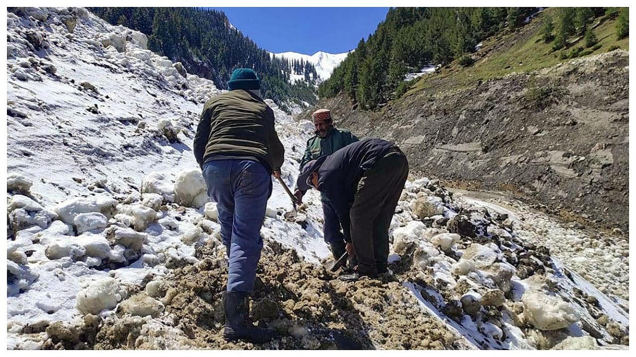IPH department workers try to restore the drinking water supply after flood following heavy monsoon rains, at Sarchu in Lahaul Spiti, Saturday, July 15, 2023. Credit: PTI Photo