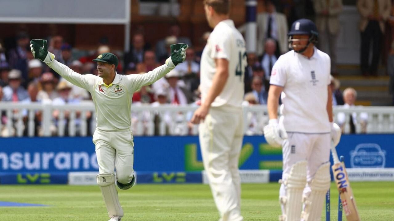  Alex Carey celebrates after running out England's Jonny Bairstow. Credit: Reuters Photo