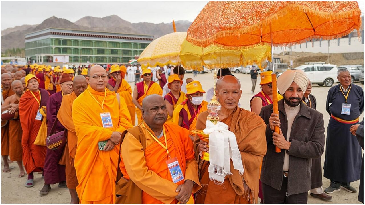 Convener, Indian Minorities Foundation, Satnam Singh Sandhu along with Buddhist Monks and Multi Faith Delegation participating in the Peace Walk to Shanti Stupa in Leh, Ladakh. Credit: PTI Photo