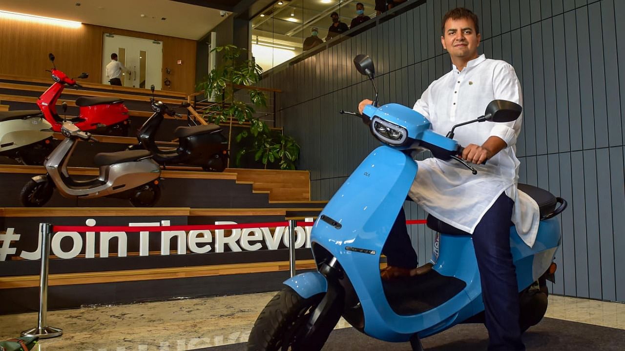 Ola founder and CEO Bhavish Aggarwal poses with newly launched OLA E-Scooter at a launch press conference in Bengaluru, Sunday, Aug. 15, 2021. Credit: PTI Photo