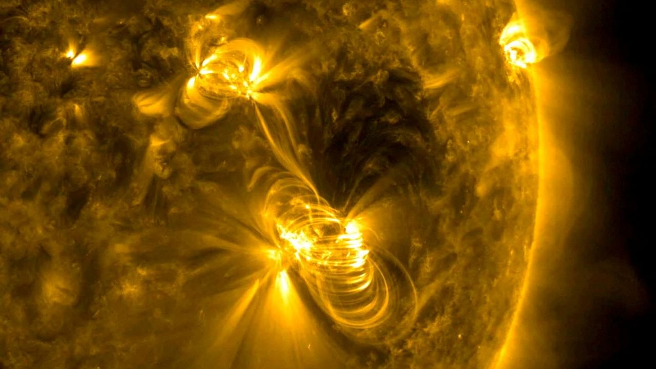 NASA image of a medium-sized (M2) solar flare and a coronal mass ejection (CME) erupting from the same, large active region of the sun. Credit: Reuters Photo