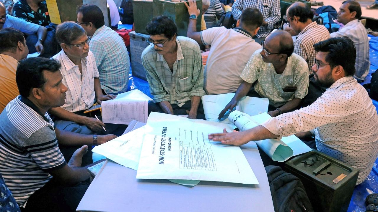 Polling officials collect ballot boxes and other election material at a distribution centre ahead of the West Bengal panchayat elections, in North 24 Parganas. Credit: IANS/ Kuntal Chakrabarty File Photo