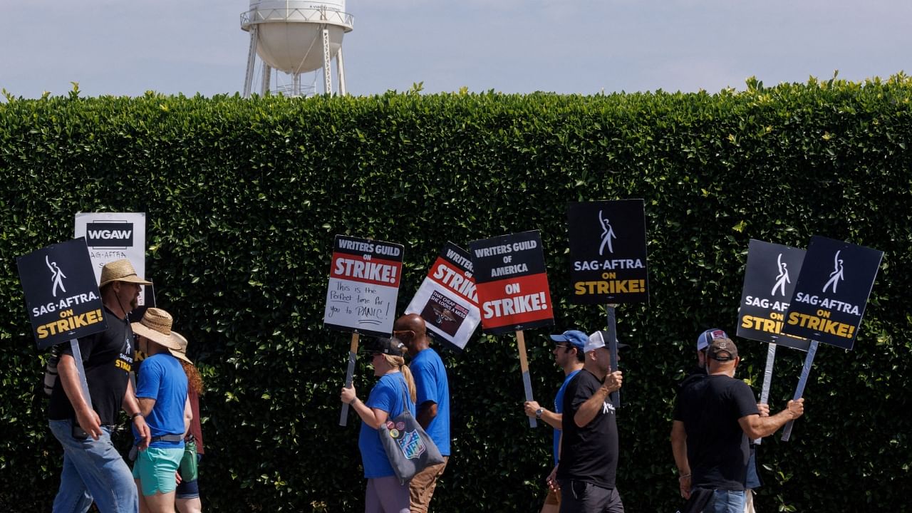 SAG-AFTRA actors and Writers Guild of America (WGA) writers walk the picket line in front of Paramount Studios in Los Angeles. Credit: Reuters Photo