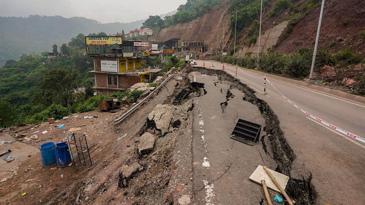 Damaged Shimla-Kalka National highway after flood following heavy monsoon rains, near Dharampur in Solan district. Credit: PTI Photo