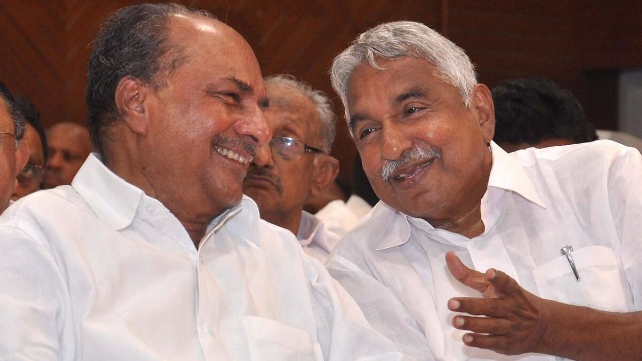 In this file photo dated Oct. 6, 2015, then Kerala Chief Minister Oommen Chandy with senior Congress leader AK Antony. Credit: PTI Photo