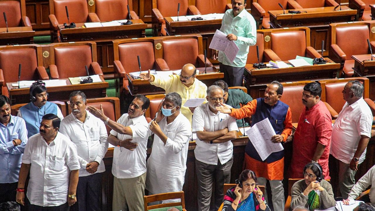 BJP MLAs stage a protest in the well of Assembly at Vidhana Soudha in Bengaluru. Credit: PTI Photo
