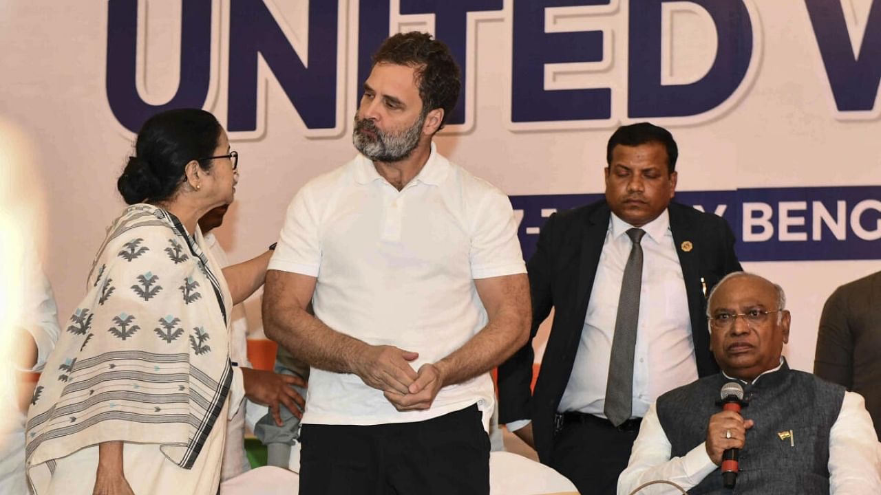 TMC supremo Mamata Banerjee with Congress leaders Rahul Gandhi and Mallikarjun Kharge. Credit: PTI Photo