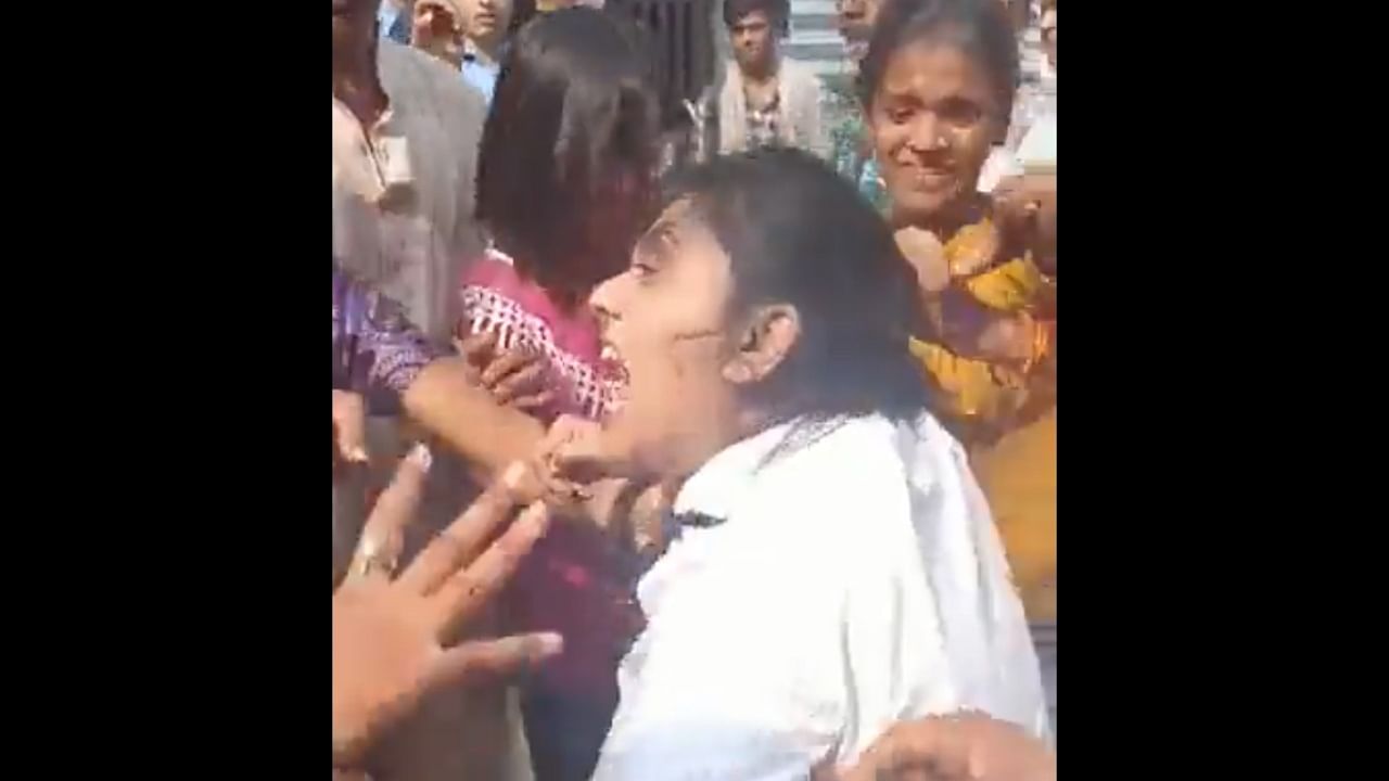 A screengrab of the video where the couple was thrashed by locals. Credit: Twitter/@Incognito_qfs