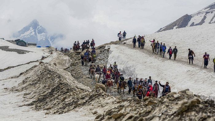 Devotees during the pilgrimage to the holy cave shrine of Amarnath, in Jammu and Kashmir, Friday, July 14, 2023. Credit: PTI Photo