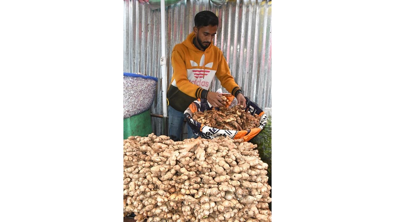 A trader sells ginger at a market in Belagavi on Wednesday. Credit: Special Arrangement